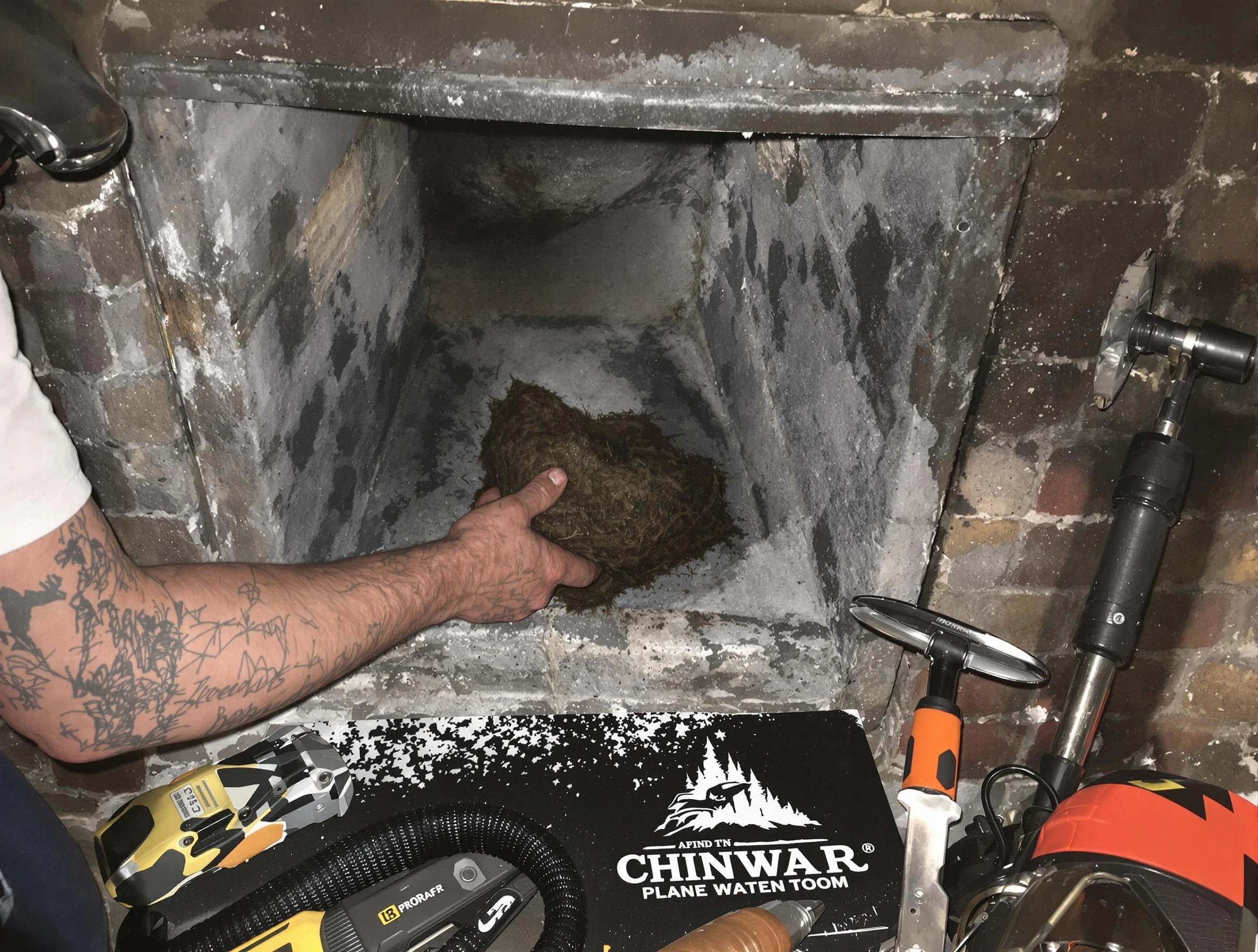 Brockton Chimney Sweep safely removing debris and screening chimney in Brockton, MA